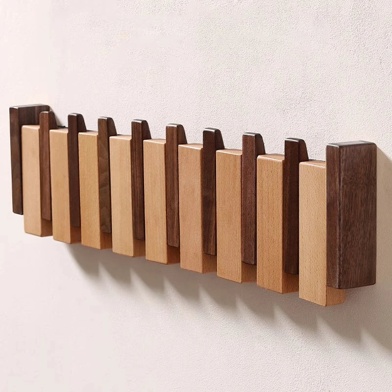 Eloria Garderobe im Klavierstil aus Holz mit klappbaren Haken