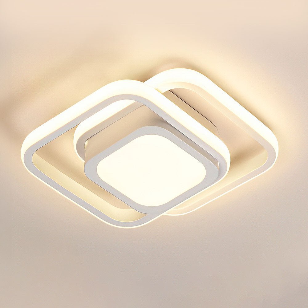Lámpara de techo con anillos geométricos entrelazados y difusores translúcidos
