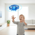 NovaHover UFO-leketøy flygende drone med håndkontroll og sensorer, USB-oppladbar