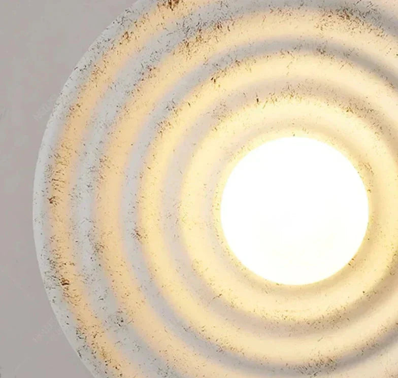 Aurelle vegglampe LED opp og ned perforert resin- og jernkonstruksjon