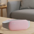 CalmCore elektrisk magetemperatur med vibrasjon for lindring av menstruasjonssmerter