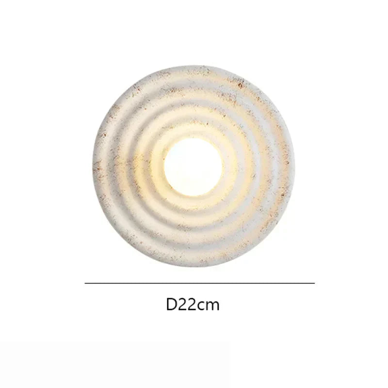 Aurelle vegglampe LED opp og ned perforert resin- og jernkonstruksjon