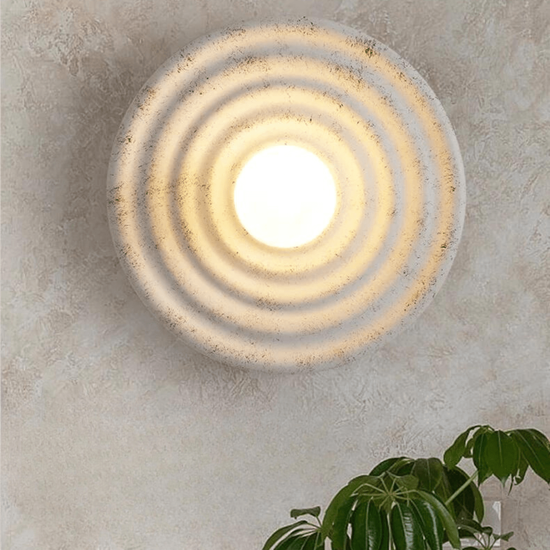 Aurelle vegglampe LED opp og ned perforert resin- og jernkonstruksjon